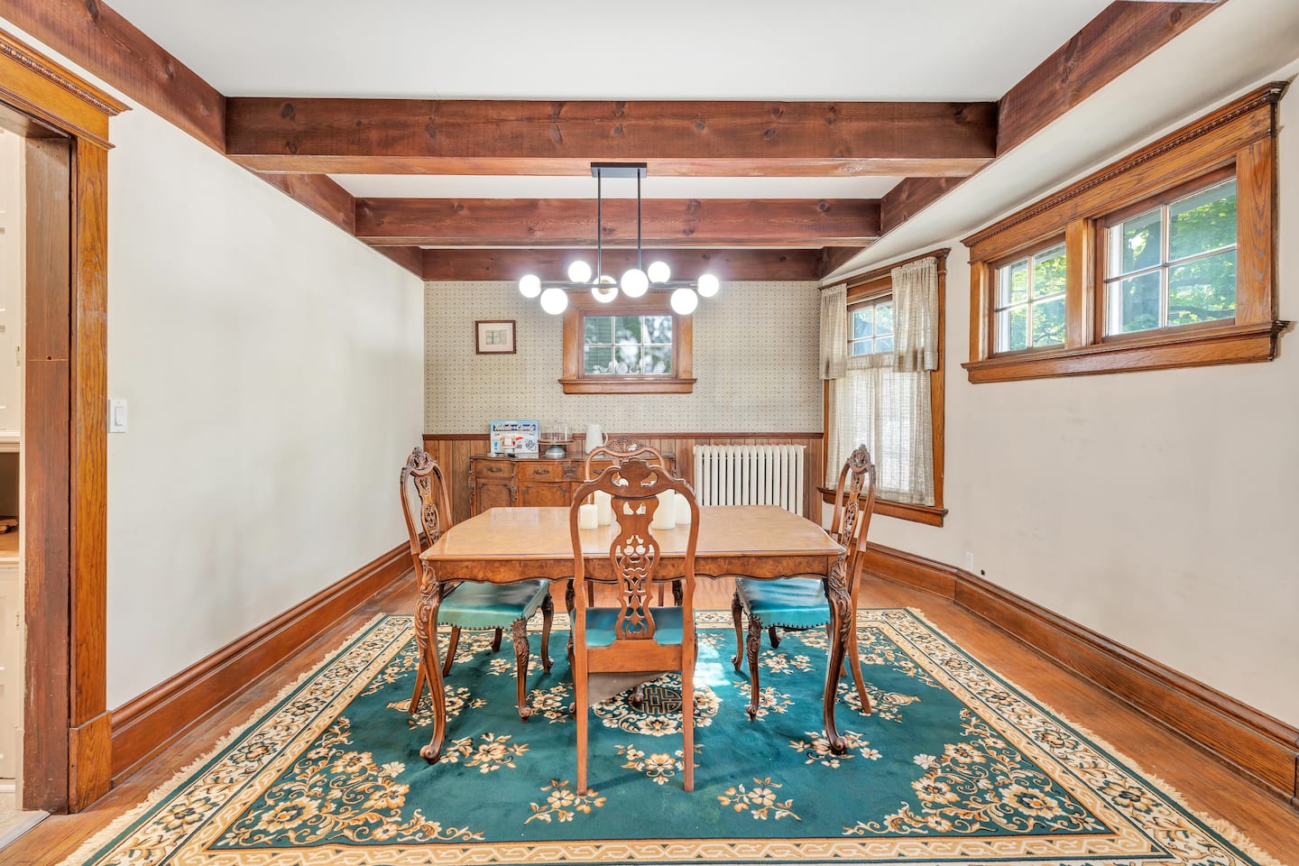 Formal dining room with beamed ceiling and original woodwork